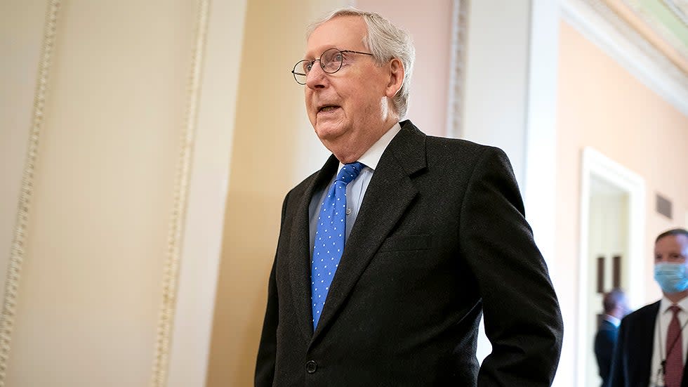 Minority Leader Mitch McConnell (R-Ky.) heads to the Senate Chamber on Wednesday, January 12, 2022.