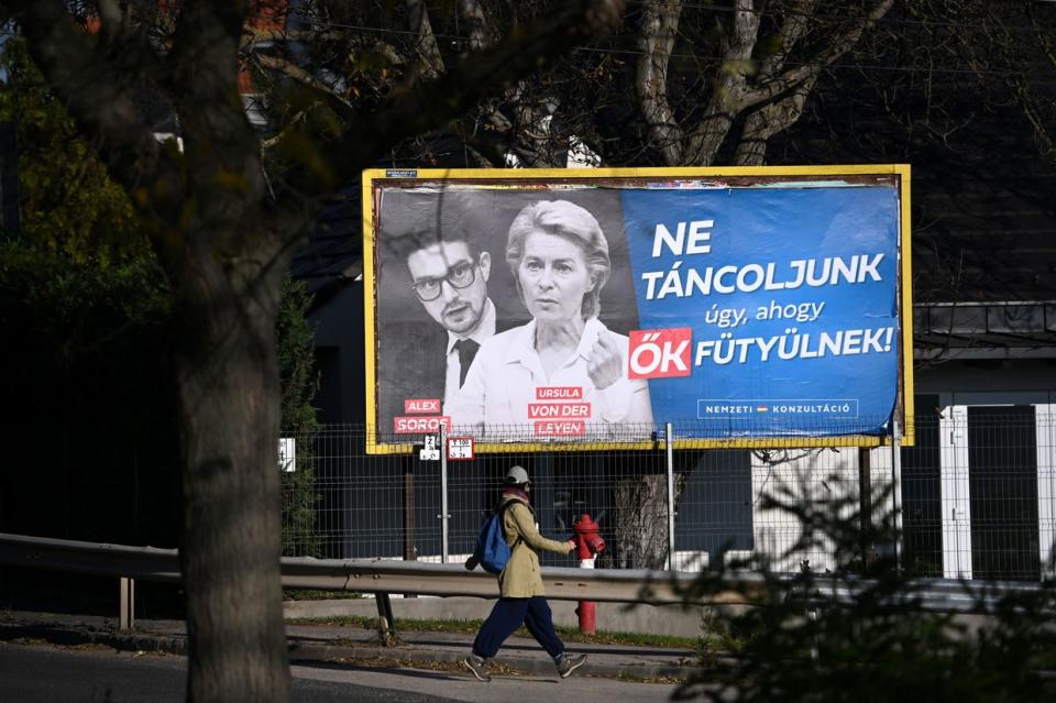 A billboard showing European Commission President Ursula von der Leyen and Alexander Soros, son of Hungarian-US billionaire George Soros, with the lettering "Let's not dance to their tunes! National consultation," in Budapest, Hungary, on Nov. 22, 2023. (Photo by Attila Kisbedenek /AFP via Getty Images)