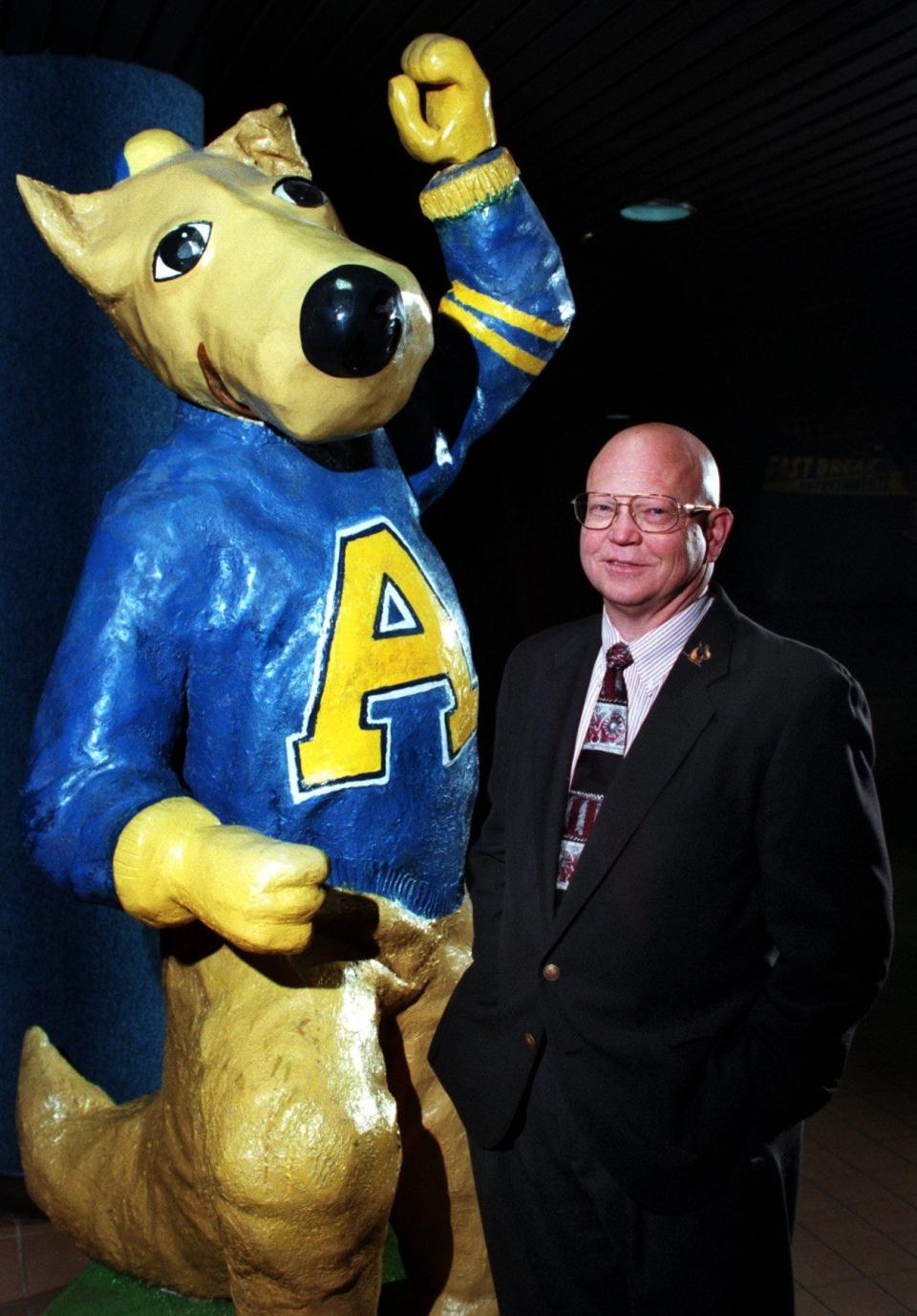 Akron Univ.-new atheletic director  Dennis Helsel. Photo taken in Rhodes Arena entrance next to Zippy statue,, mascot for the school. 