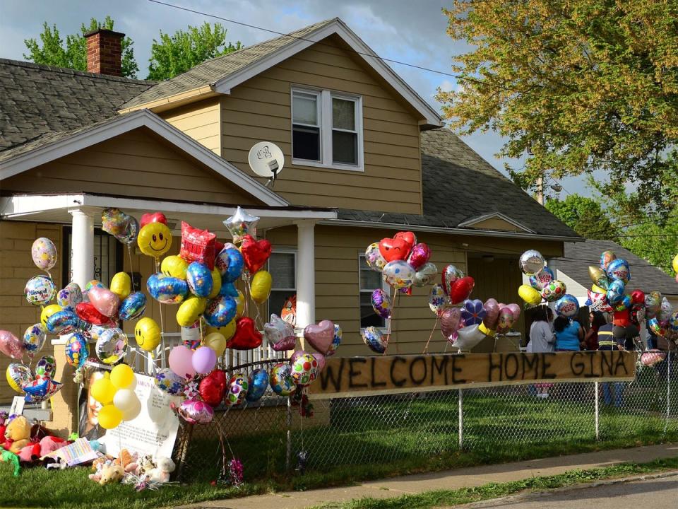 The family home of Gina DeJesus is decorated by well-wishers (Getty Images)