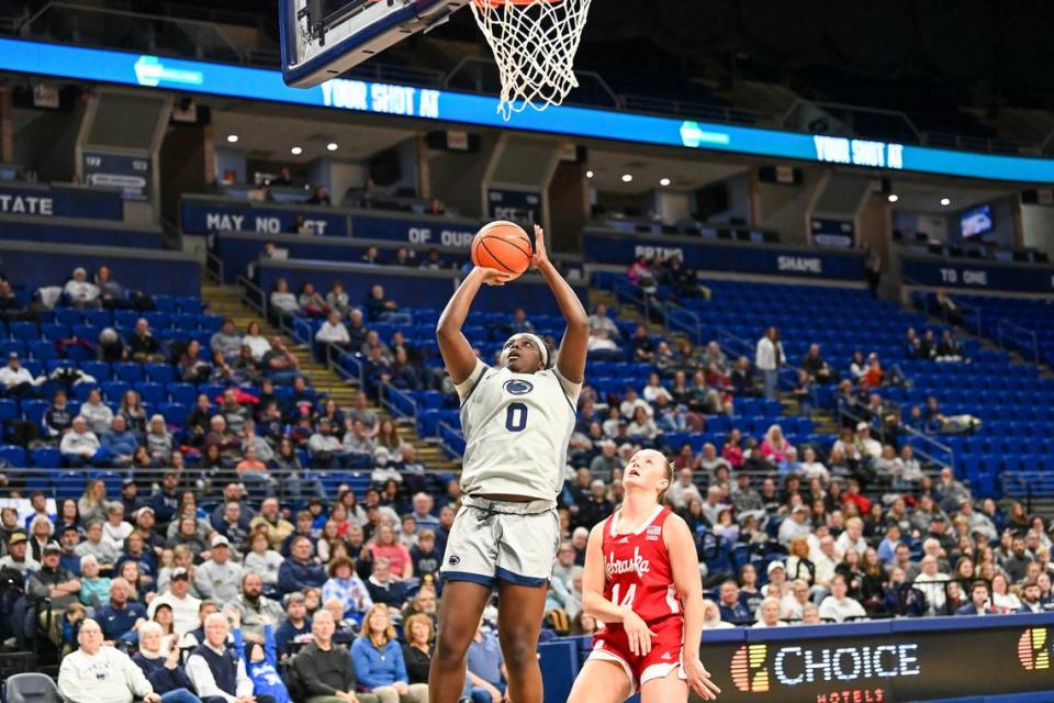 Penn State’s Ashley Owusu shoots for 2 as a Cornhusker looks on during Sunday’s game.