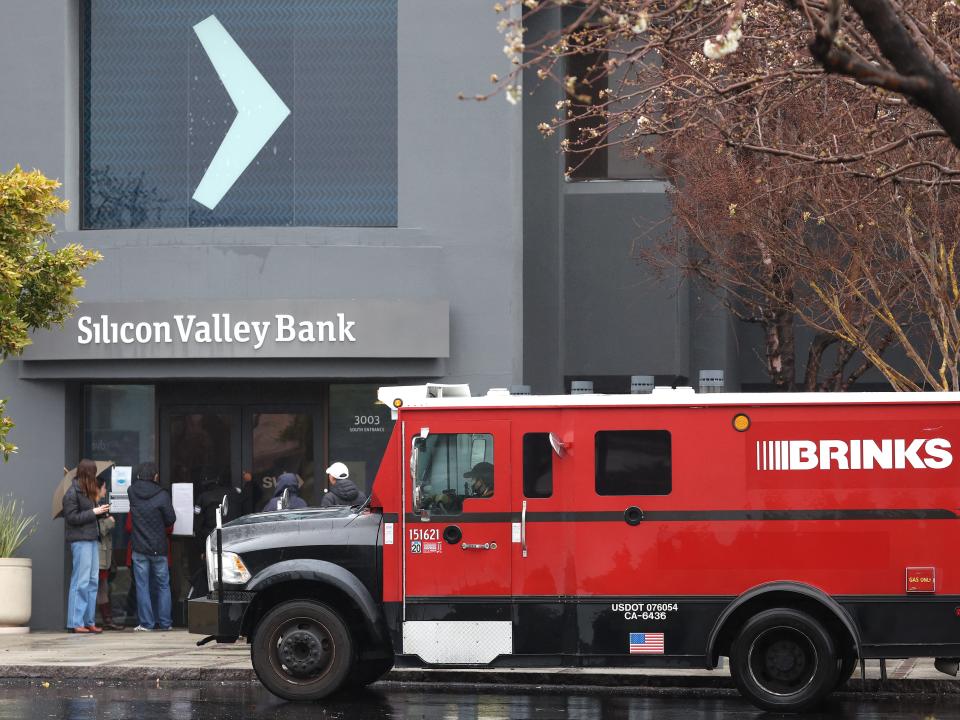 A Brinks armored truck sits parked in front of the shuttered Silicon Valley Bank (SVB) headquarters on March 10, 2023 in Santa Clara, California.