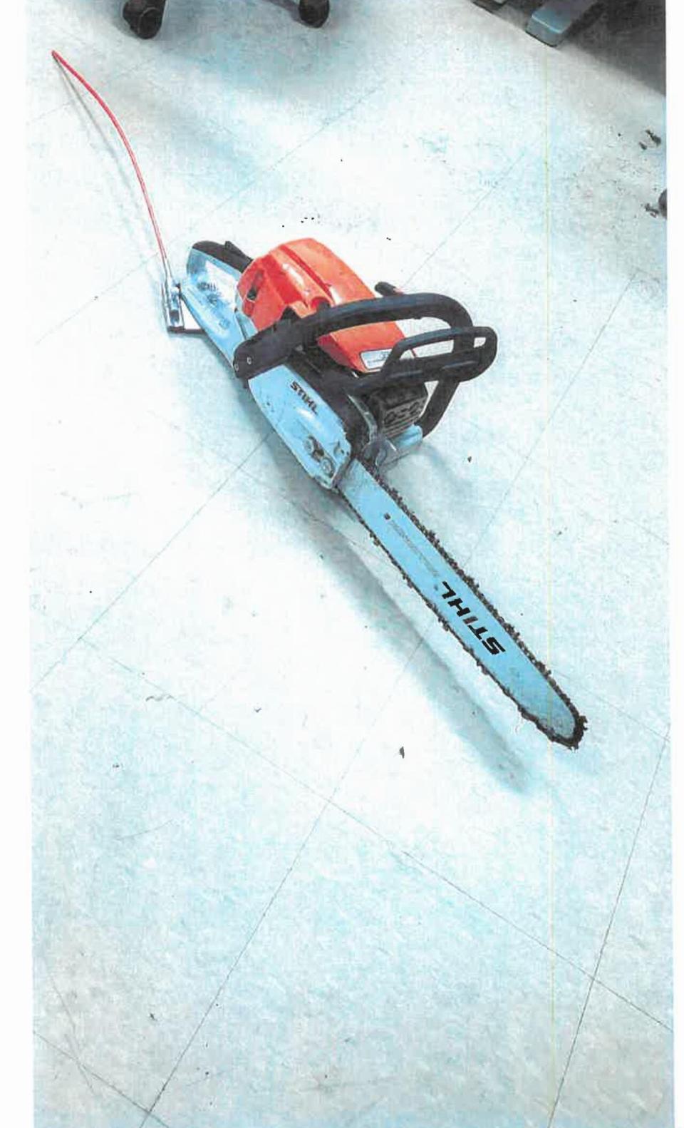 A photo entered as an exhibit during the sentencing hearing shows the chainsaw Augustine was holding after the crash. 