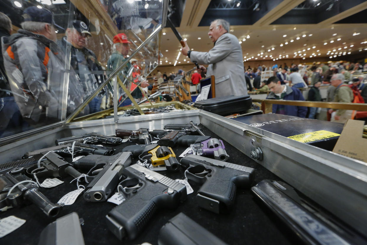 Handguns on display at a gun convention in New York. (Philip Kamrass/AP)