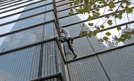 French free-climber Alain Robert, known as 'Spiderman', attempts to climb up the outside of the Heron Tower in the financial district of London, Britain, October 25, 2018. REUTERS/Peter Nicholls