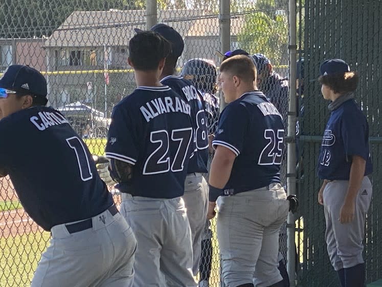 Birmingham players cheering on teammates during 9-2 upset of top-seeded Granada Hills.