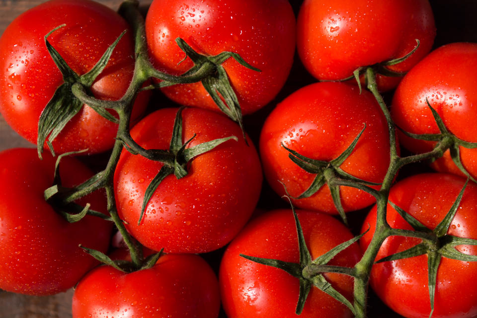 Top view of hydroponic cherry tomatoes on vine. Healthy organic food background. Horizontal