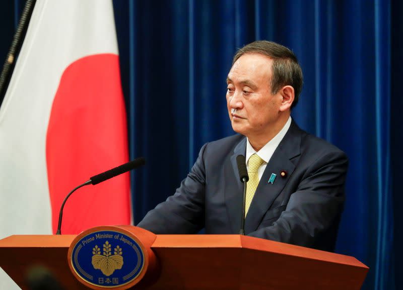 Japanese Prime Minister Yoshihide Suga speaks during a news conference in Tokyo