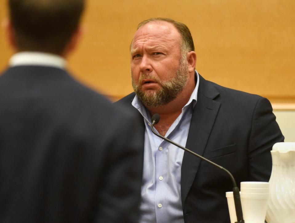 Infowars founder Alex Jones takes the witness stand to testify on 23 September (REUTERS)