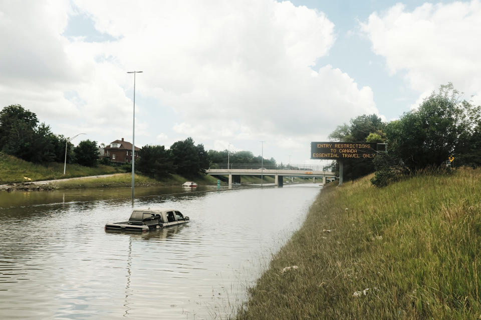 DETROIT, MICHIGAN, UNITED STATES - 2021/06/28: Car remains inundated in floodwaters on a flooded portion of I-94 in Detroit, Michigan several days after heavy rains flooded parts of the city.
After a weekend of heavy storms beginning on Friday night and lasting through the weekend rainwater flooded parts of I-94 in Detroit, Michigan forcing some motorists to abandon their vehicles and seek shelter from the heavy rains. Flood waters remained in areas along I-94 between Dearborn and Downtown Detroit several days later as Michigan Governor Gretchen Whitmer held a press conference on the still inundated I-94. (Photo by Matthew Hatcher/SOPA Images/LightRocket via Getty Images)