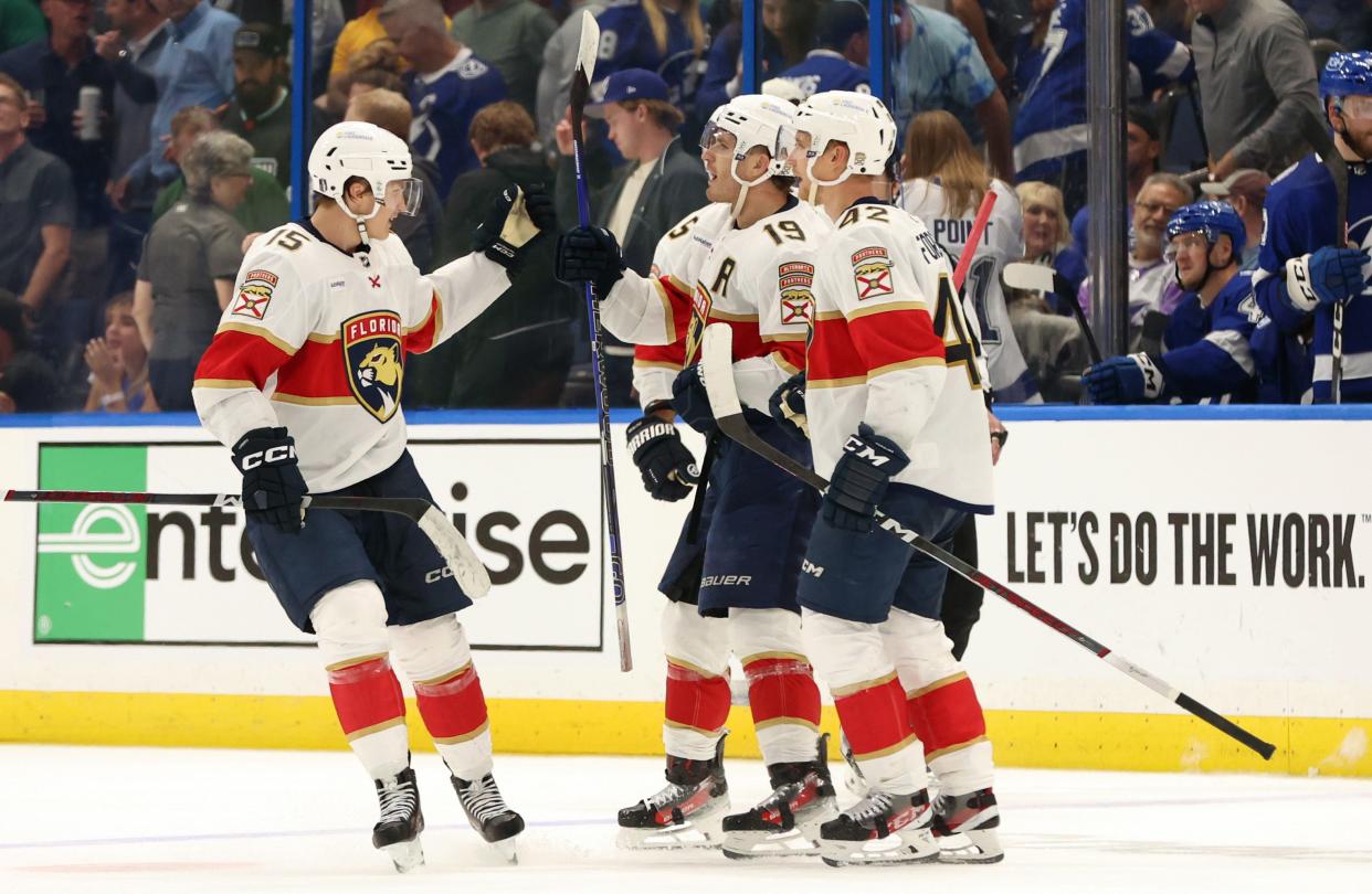 Florida Panthers left wing Matthew Tkachuk (19) is congratulated by teammates after scoring in the third period against the Tampa Bay Lightning.