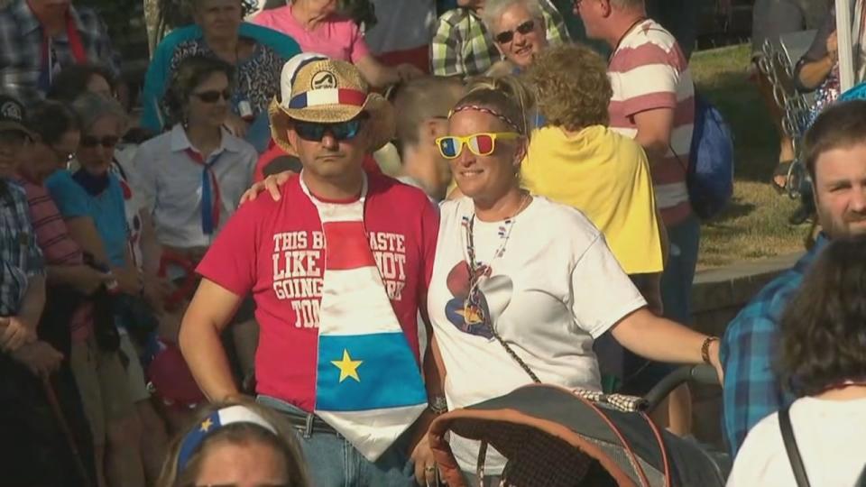 Many dress in the colours of the Acadian flag to celebrate Acadian Day.