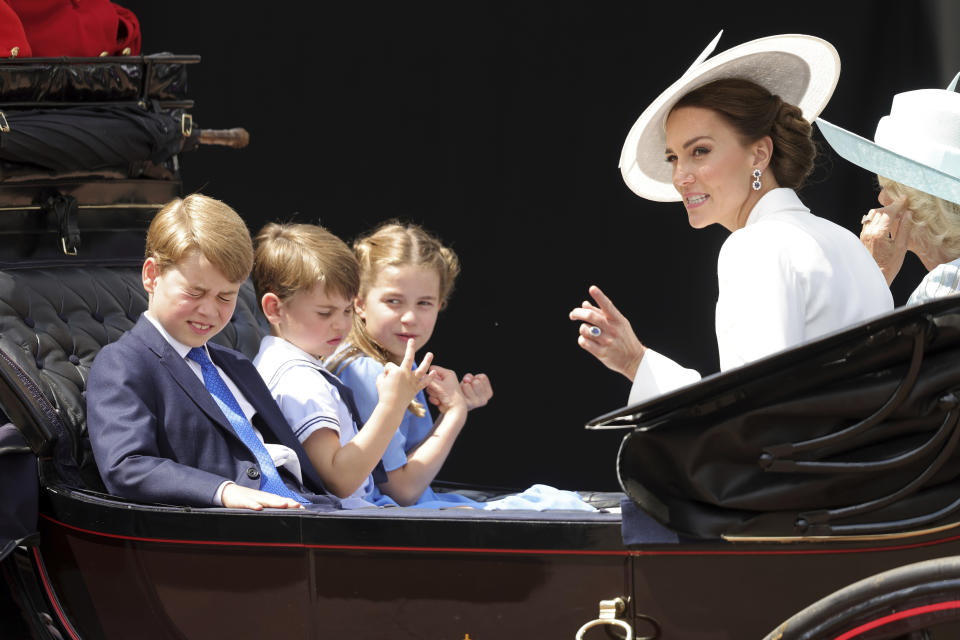 FILE - From left, Britain's Prince George, Prince Louis, Princess Charlotte, Kate, Duchess of Cambridge and Camilla, Duchess of Cornwall ride in a carriage during the Trooping the Color parade in London, Thursday June 2, 2022, on the first of four days of celebrations to mark the Platinum Jubilee. (Chris Jackson/Pool Photo via AP, File)