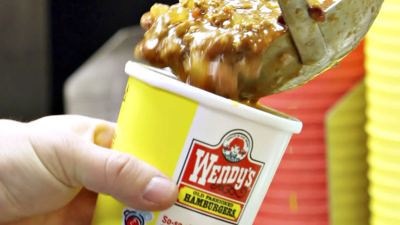 pouring Wendy's chili in bowl