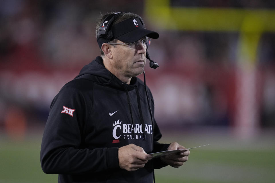 Cincinnati head coach Scott Satterfield walks the sideline during the second quarter of an NCAA college football game against Houston, Saturday, Nov. 11, 2023, in Houston. (AP Photo/Kevin M. Cox)