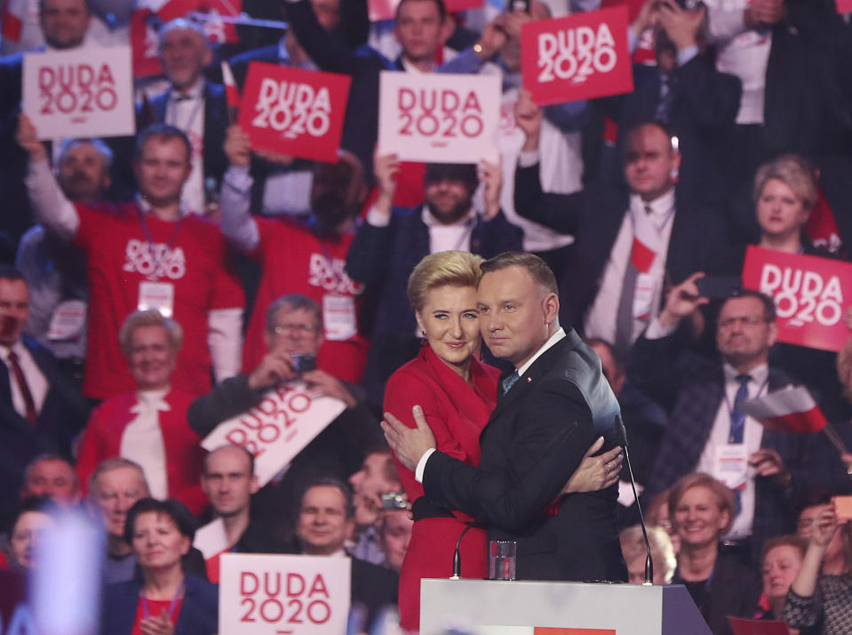 File - In this file photo taken Feb. 15, 2020, in Warsaw, Poland are seen Poland's President Andrzej Duda, right, with wife Agata Kornhauser-Duda, campaigning for Duda's re-election in May 10 national vote. The Polish government’s determination to move forward with the May 10, presidential election during the coronavirus pandemic by making it an all-postal vote, though critics say the plan threatens public health and democracy in Poland. (AP Photo/Czarek Sokolowski)