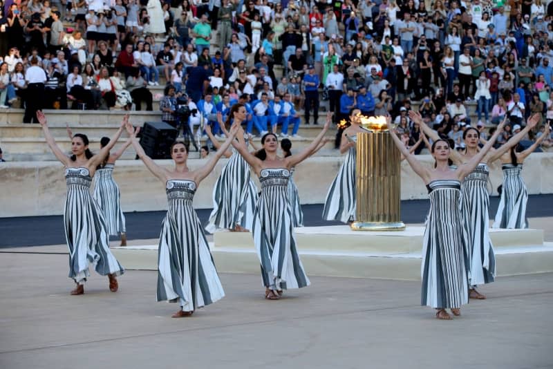 Greek actresses playing the role of priestesses perform during the Olympic Flame handover ceremony, at the Panathenaic Stadium in Athens. Aristidis Vafeiadakis/ZUMA Press Wire/dpa