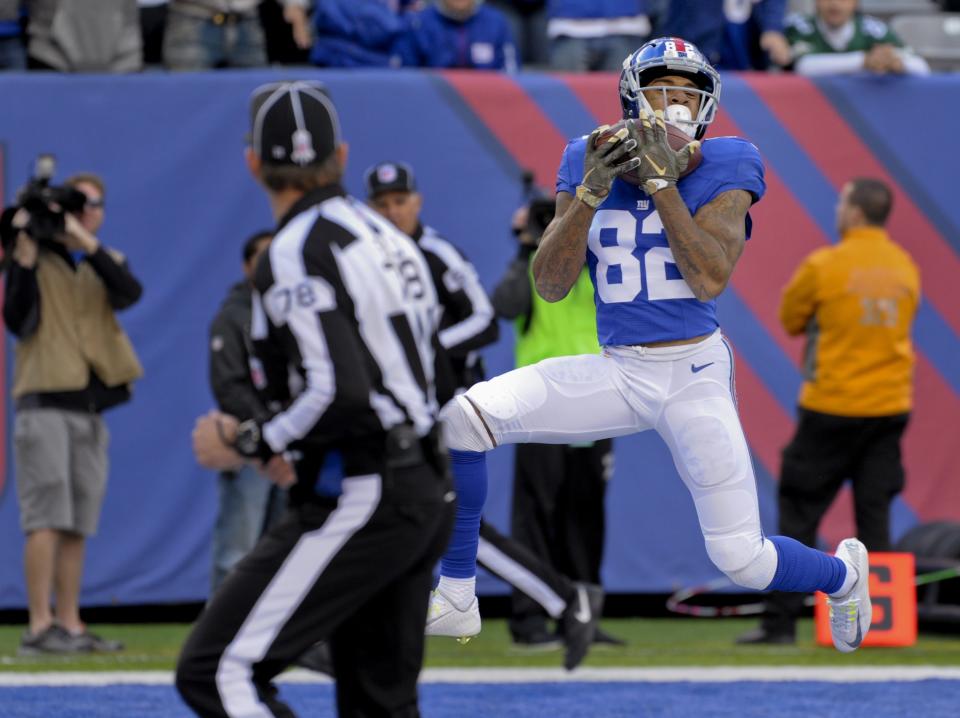 <p>New York Giants wide receiver Roger Lewis (82) catches a pass for a touchdown against the Philadelphia Eagles during the first quarter of an NFL football game, Sunday, Nov. 6, 2016, in East Rutherford, N.J. (AP Photo/Bill Kostroun) </p>