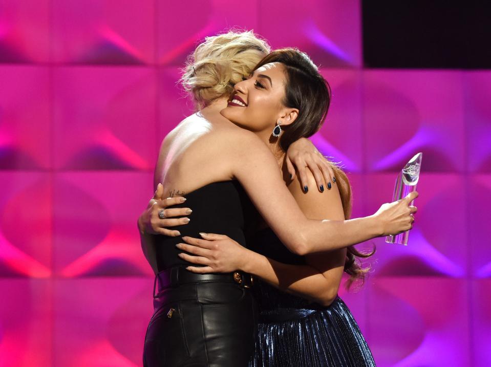 Selena Gomez (L) Accepts the Woman of the Year Award with Francia Raisa onstage at Billboard Women In Music 2017 at The Ray Dolby Ballroom at Hollywood & Highland Center on November 30, 2017 in Hollywood, California.