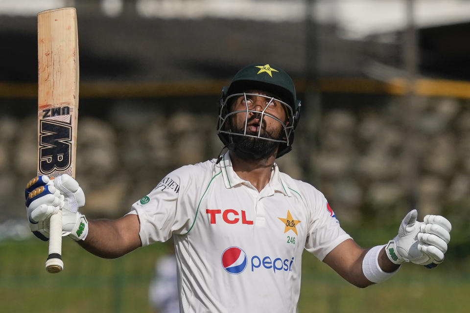 Pakistan's Abdullah Shafique looks skywards as he celebrates scoring a double century during the third day of the second cricket test match between Sri Lanka and Pakistan in Colombo, Sri Lanka on Wednesday, Jul. 26. (AP Photo/Eranga Jayawardena)