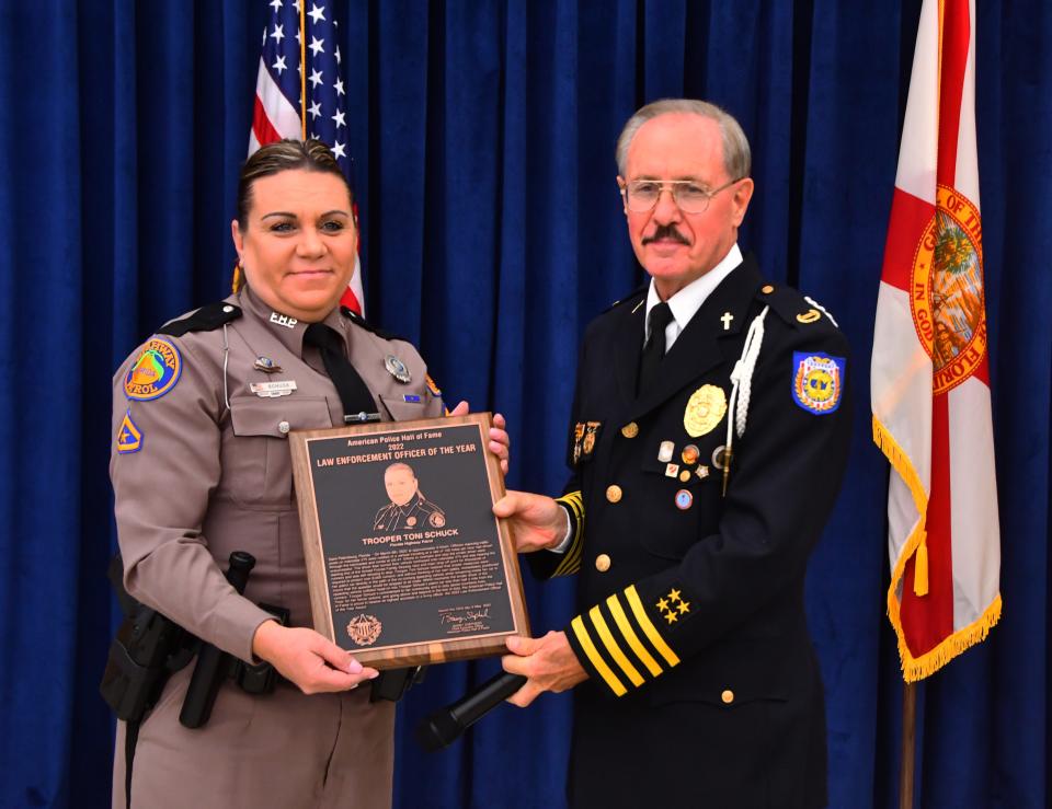 Florida Highway Patrol Trooper Toni Schuck was presented the national Law Enforcement Officer of the Year award at the American Police Hall of Fame & Museum in Titusville by Chief/Chaplain Jack Rinchich, president of the National Association. of Chiefs of Police.