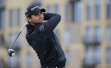 Jason Day of Australia watches his tee shot on the third hole during the third round of the British Open golf championship on the Old Course in St. Andrews, Scotland, July 19, 2015. REUTERS/Paul Childs