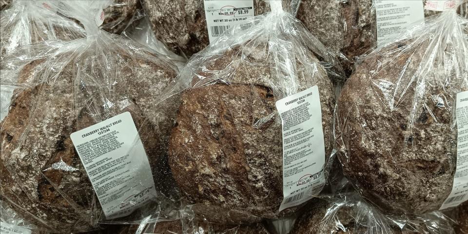Brown loaves of cranberry walnut bread in clear packaging at Costco