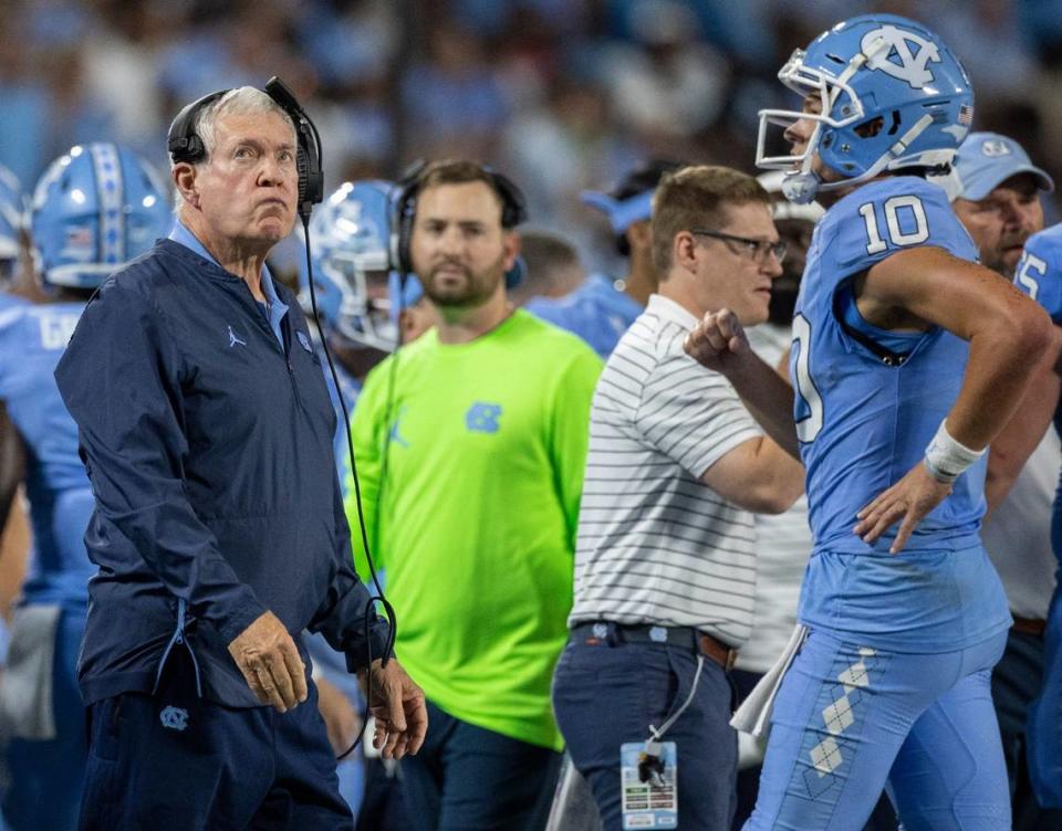 North Carolina coach Mack Brown glances at the replay after a dropped pass by Gavin Blackwell (2) turned the ball over to South Carolina in the second quarter on Saturday September 2, 2023 at Bank of America Stadium in Charlotte, N.C.