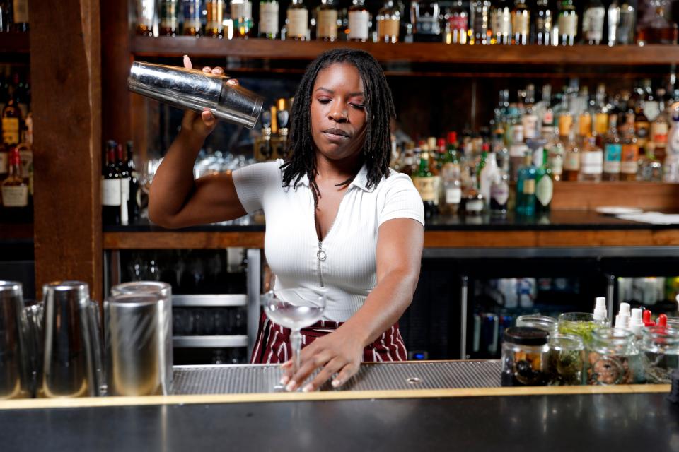 Loretha Kirk, a bartender ranked by the U.S. Bartending Guild as a World Class US Top 100 bartender for 2024, mixes a drink on Feb. 20 inside the T Room at The Jones Assembly.