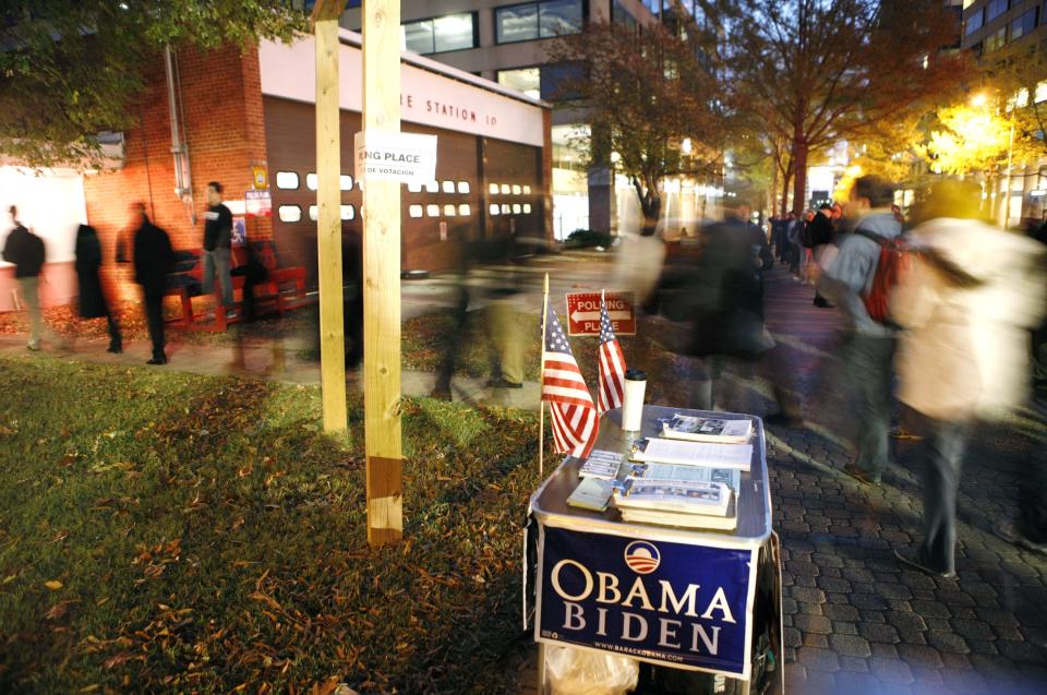 People queue in Arlington, Virginia, where Obama won four years ago - the first time a Democrat won since 1964 (Rex)