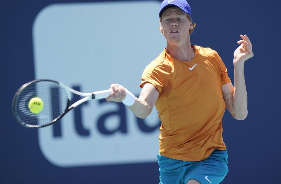 Jannik Sinner of Italy returns a shot from Nick Kyrgios of Australia, during the Miami Open tennis tournament, Tuesday, March 29, 2022, in Miami Gardens, Fla. (AP Photo/Wilfredo Lee)