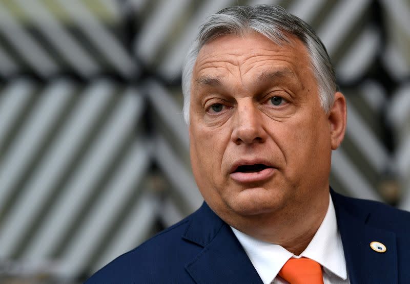 FILE PHOTO: Hungary's Prime Minister Viktor Orban addresses the media as he arrives on the first day of the European Union summit at The European Council Building in Brussels, Belgium June 24, 2021.