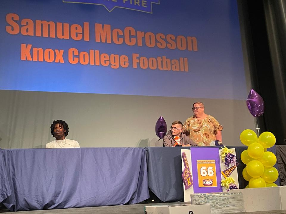 Samuel McCrosson (seated, right), joined by his mom, was one of several Cocoa Beach seniors signing with college sports programs on May 8, 2024.