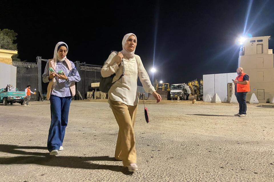 A woman walks after crossing on the Egyptian side of the Rafah border crossing with the Gaza Strip (Getty Images)