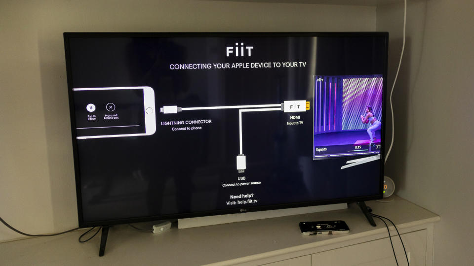 The FiiT app being connected to a TV using a cable