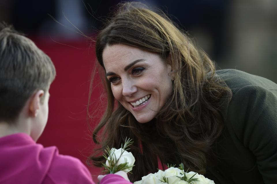 Britain's Kate Duchess of Cambridge speaks with a pupil as she meets the members of the public at Centenary Square in Bradford northern England, Wednesday, Jan. 15, 2020. (AP Photo/Rui Vieira)