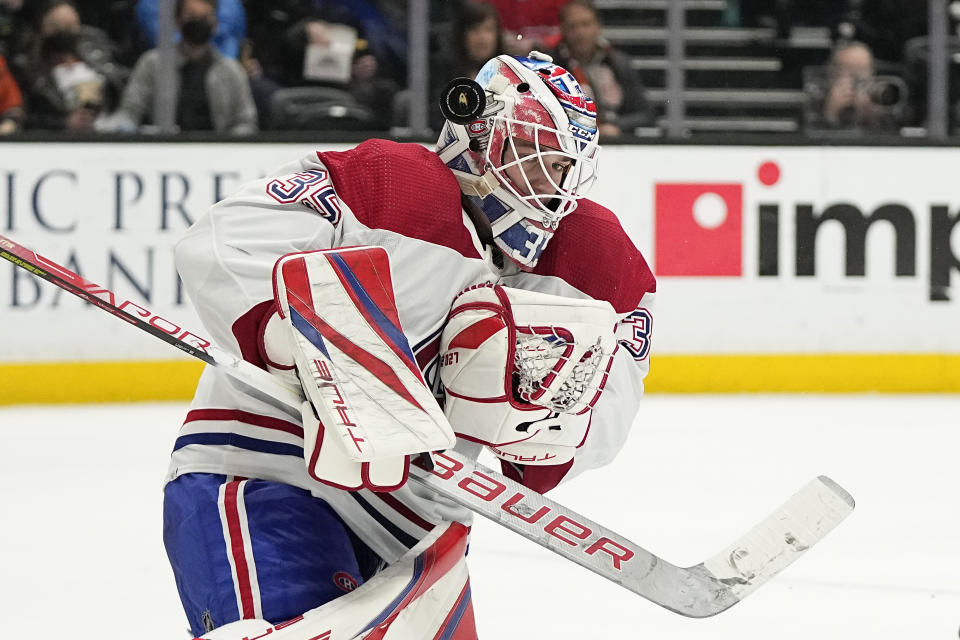 Montreal Canadiens goaltender Sam Montembeault juggles the puck during the third period of an NHL hockey game against the Anaheim Ducks Friday, March 3, 2023, in Anaheim, Calif. (AP Photo/Mark J. Terrill)