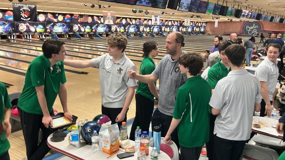 Pascack Valley bowler Joe Quinn (left) a pat on the back from Nick Brindisi and a fist bump from coach Jason Kalish of Jefferson. The Falcons defeated Pascack Valley, 2-1, in a close match for the North 1, Group 3 boys bowling title at Bowler City on Feb. 24, 2024.