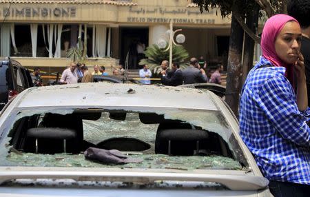 A car damaged as a result of a car bomb attack on the convoy of Egyptian public prosecutor Hisham Barakat near his house at Heliopolis district, is seen in Cairo, Egypt, June 29, 2015. REUTERS/Mohamed Abd El Ghany