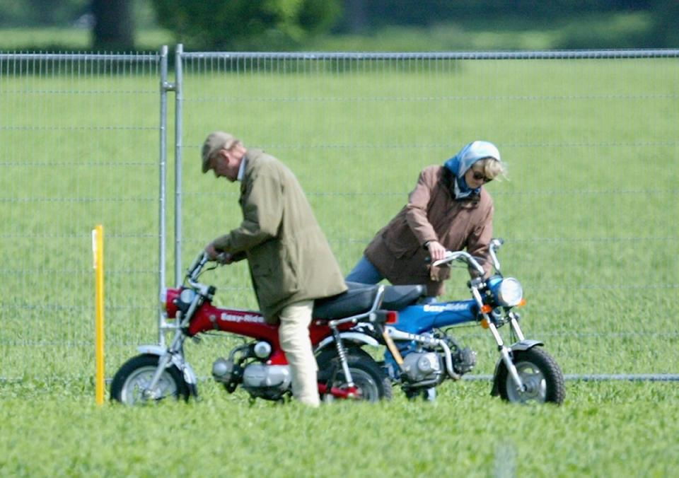 HRH Prince Philip, The Duke of Edinburgh and Lady Penny Romsey mount their mini motorbikes during the Royal Windsor Horse Show at Home Park, Windsor Castle on May 13, 2005 (Getty Images)