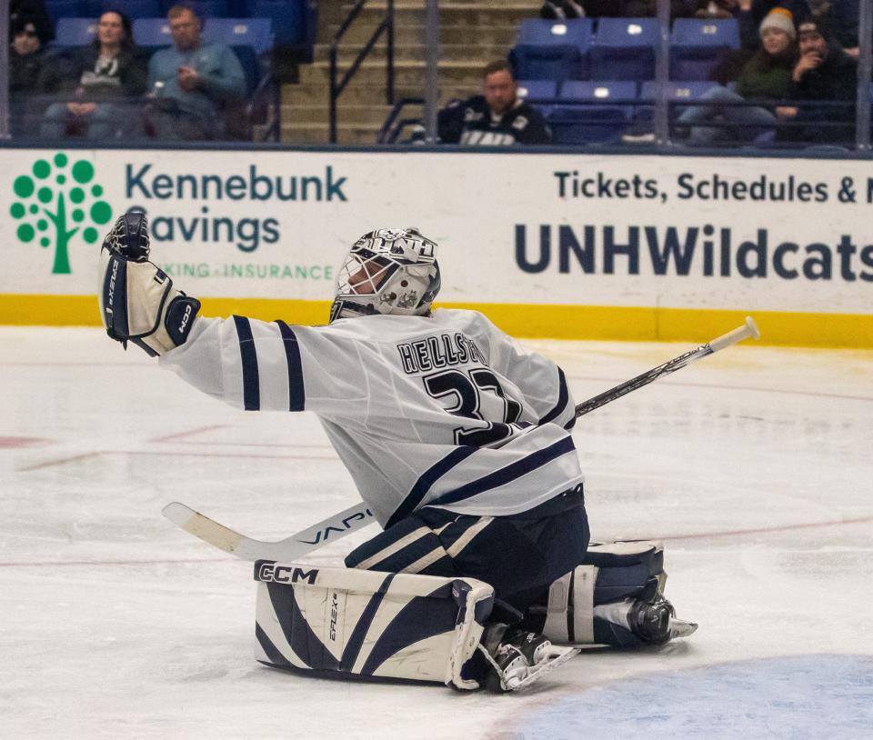 UNH goalie Jakob Hellsten makes one of his 21 saves during Wednesday's 1-0 win over UMass-Lowell in a Hockey East first-round game at the Whittemore Center. UNH will visit rival Maine on Saturday.