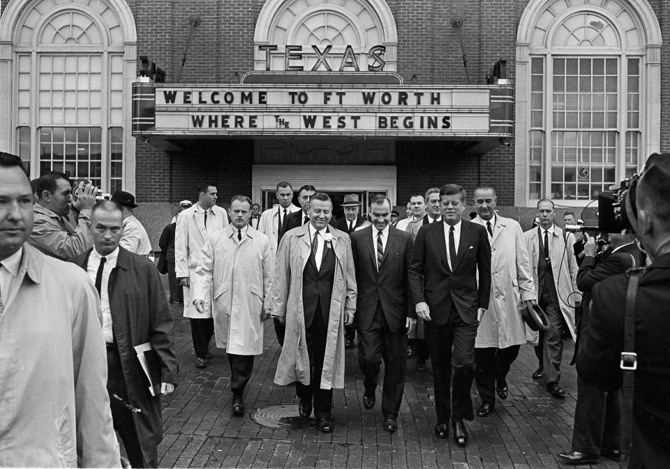 President John F. Kennedy, front, right, exits the Hotel Texas in Fort Worth, at 8:45 a.m., Nov. 22, 1963. He is on his way to greet crowds and make a speech. At right holding hat and wearing raincoat is Vice President Lyndon B. Johnson. (Photo: AP)