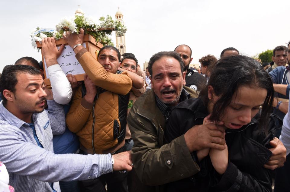 Mourners carry the coffin of a victim of the blast at the Coptic Christian Saint Mark's church in Alexandria.