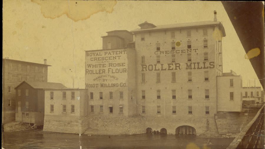 A historic photo of the old Voigt Mill along the Grand River in Grand Rapids. (Courtesy: Collections of the Grand Rapids Public Museum)