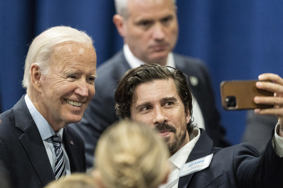 FILE - President Joe Biden takes a selfie with a supporter after speaking at a Democratic National Committee event at the Gaylord National Resort and Convention Center, Sept. 8, 2022, in Oxon Hill, Md. A boisterous mood marked the Democratic National Committee’s recent summer gathering near Washington. Party officials are feeling emboldened ahead of midterm elections, a turnabout from the effects of high inflation and other political liabilities that have weighed heavily on Democrats much of the last year. (AP Photo/Alex Brandon, File)