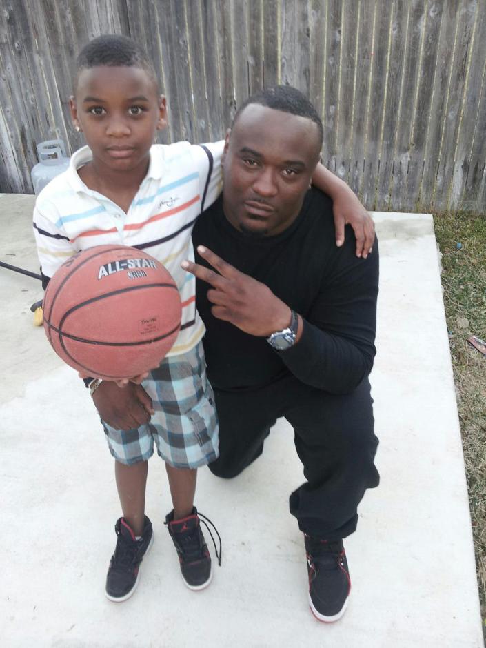 Javier Ambler and his son J’Vaughn shown in a family photo. Ambler died while in police custody March 2019. [Family photo]