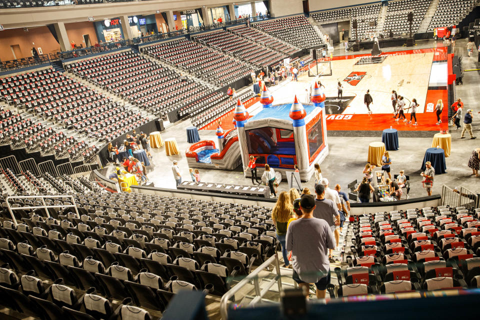 Guests walk down toward the basketball court during the grand opening of F&M Bank Arena in Clarksville, Tenn. on Saturday, July 15, 2023.