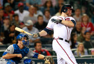 ATLANTA, GA - APRIL 17: Brian McCann #16 of the Atlanta Braves hits a double into deep right in the fifth inning against the New York Mets at Turner Field on April 17, 2012 in Atlanta, Georgia. (Photo by Kevin C. Cox/Getty Images)