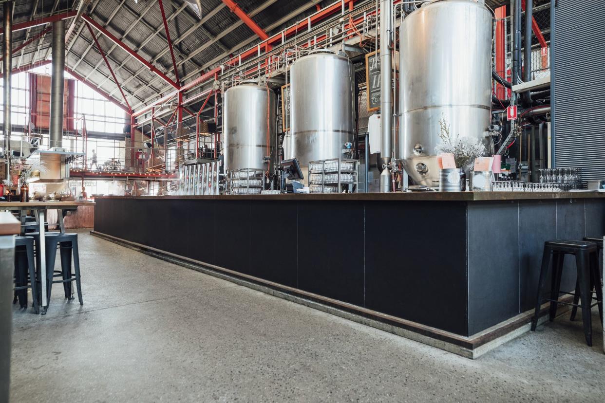 A wide angle view of a working brewery that is also a bar in Perth Australia.