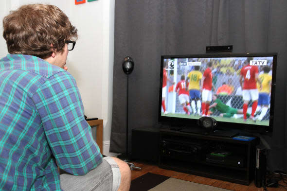 man watching World cup on TV